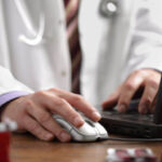 Doctor using computer