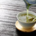 pouring-green-tea-into-a-cup