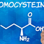 Hand with pen drawing the chemical formula of homocysteine