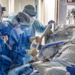 Dr. James Gasperino, background center, chief of medicine and critical care, at the Brooklyn Hospital Center in New York, March 30, 2020. (Victor J. Blue/The New York Times)