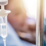 Closeup of the IV drip on the hanger. Selective focus.