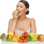 Assorted-Fruit-Woman-Eating-Apple-1200x800