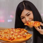 Beautiful,Asian,Girl,Eats,Pizza,Gluttony,Is,Dinner,,Eaten,Before