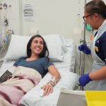 uclh_patient_emily_henders_shares_a_joke_with_ward_sister_amy_colada_on_the_day_of_her_car_t_infusion_lnh01111