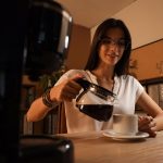 Young-Businesswoman-Pouring-Hot-Coffee