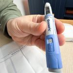 Hand-Holding-Blue-GLP-1-Semaglutide-Ozempic-Pen-Close-Up-1200x800