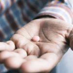 man-takes-a-pill