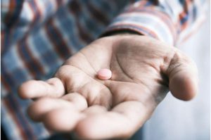 man-takes-a-pill